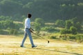 Golfer sport course golf ball fairway.ÃÂ  People lifestyle man playing game golf tee off on the green grass.ÃÂ  Royalty Free Stock Photo